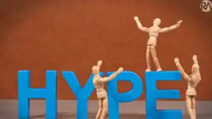 Wooden mannequins interact with blue "HYPE" letters, symbolizing data-driven marketing success.