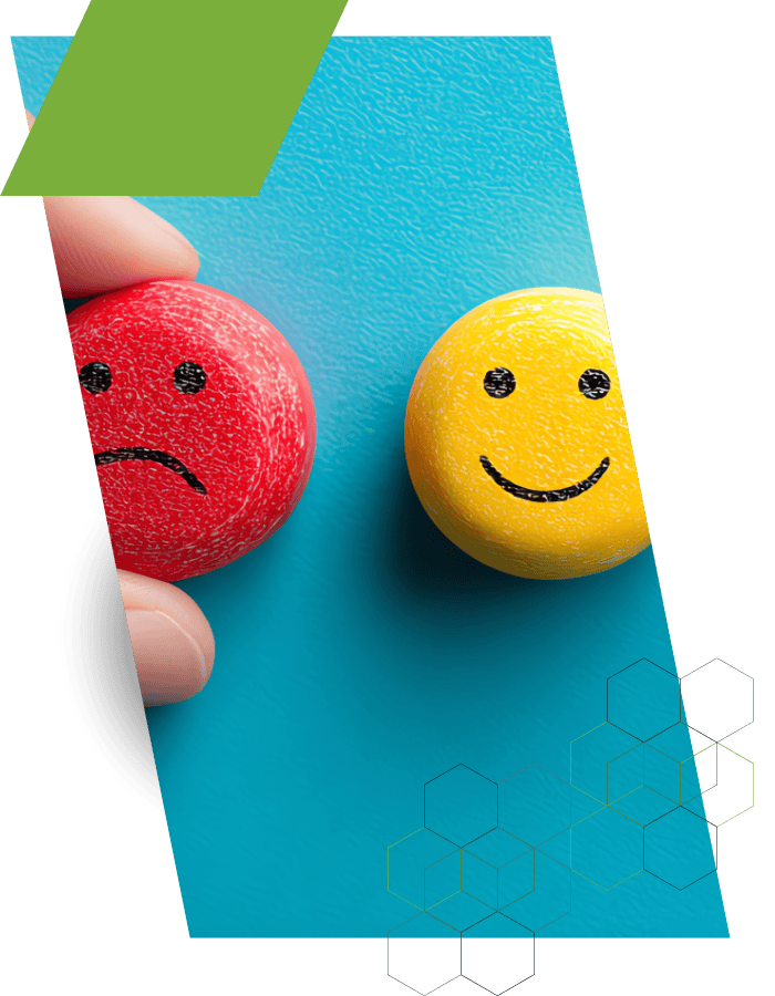 Red sad face and yellow happy face representing pricing emotions and consumer behavior.